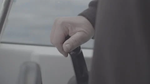 Boat skipper throttles forward and turns wheel Stock-Footage 162873539
