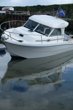 Boat in small harbor 스톡 사진