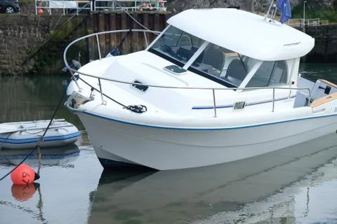 Boat in small harbor Stock Photos
