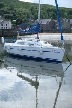 Boat in small harbor Stock Photos