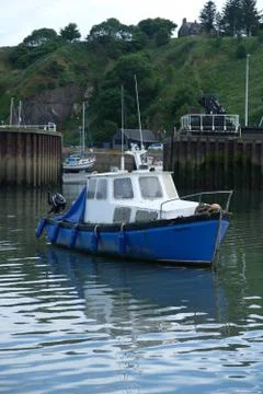 Boat in small harbor Stock Photos