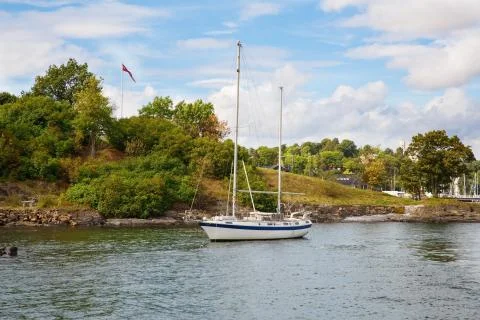Boat in small harbor Stock Photos