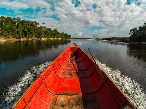 Boat speeding down an Amazon river in Venezuela Stock Photos