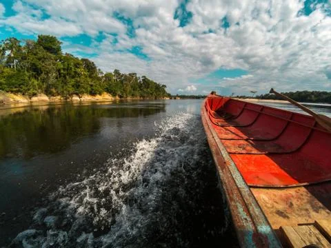 Boat speeding down an Amazon river in Venezuela Stock Photos