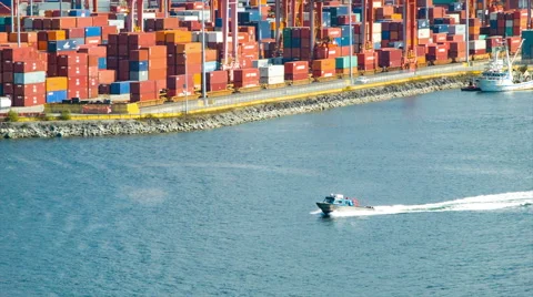 Boat Speeding Through Vancouver Harbour with Cargo Container Backdrop Stock Footage 61007877