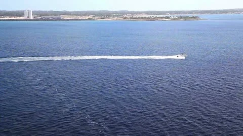 Boat speeding by in the water Stock Footage 12252128