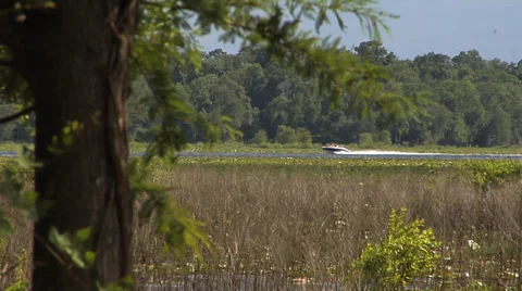 Boat speeds through frame Stock Footage 39580910