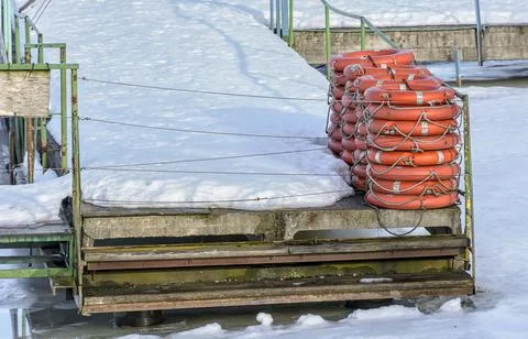 A boat station closed until spring on the banks of the Izhora River in Kolpin Stock Photos