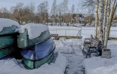 A boat station closed until spring on the banks of the Izhora River in Kolpin Stock Photos