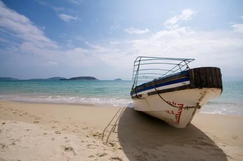 Boat stranded on beach Stock Photos
