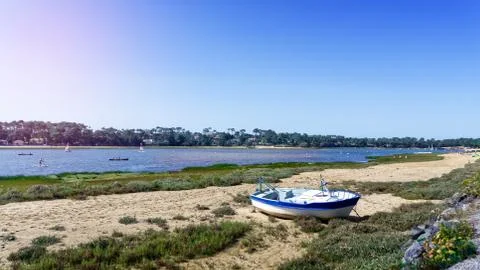 Boat stranded on the sand in front of Hossegor lake Stock Photos