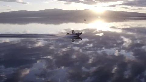 Boat with summer sunset reflection on lake Stock Footage 71694801