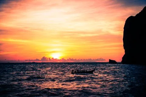 Boat in sunset close to Ko Phi Phi. Stock Photos