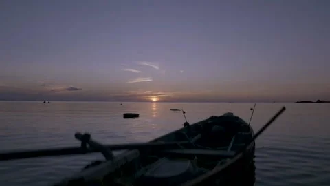 Boat in the sunset during covid 19 Stock Footage