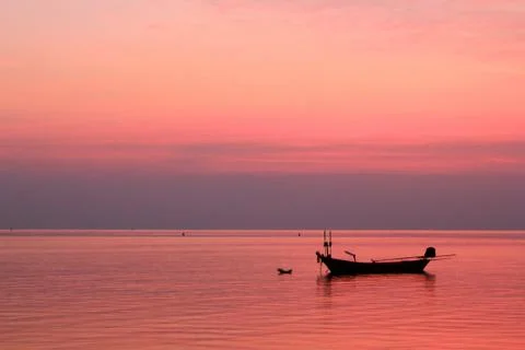 Boat sunset ocean Stock Photos