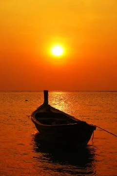 Boat in sunset Stock Photos