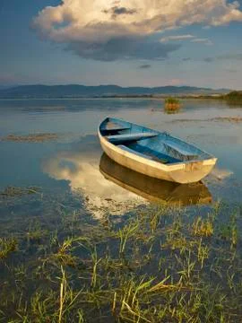 Boat on sunset Stock Photos