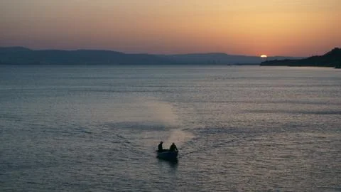 Boat at sunset Stock Photos