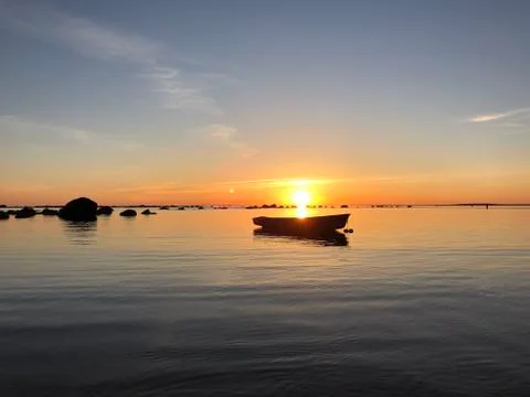 Boat on sunset Stock Photos