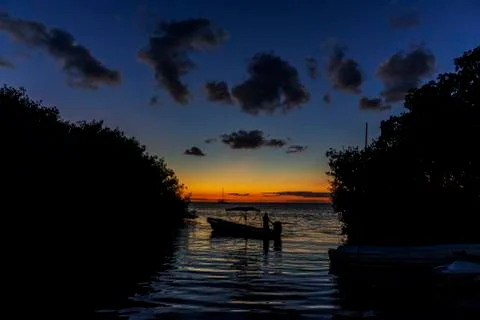 Boat at sunset Stock Photos