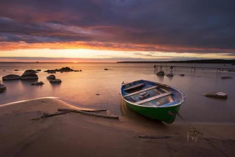 Boat at sunset Stock Photos