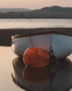 A boat at sunset Stock Photos