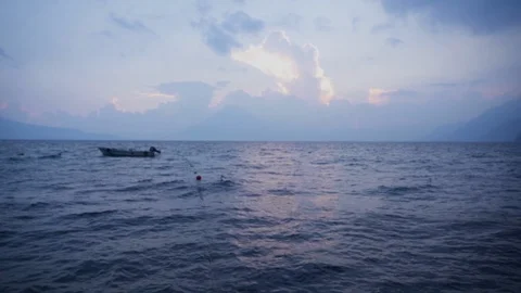 Boat at Sunset with Volcano, Lake Atitlan, Panajachel, Guatemala, Slow Motion 08 Stock Footage 125047486