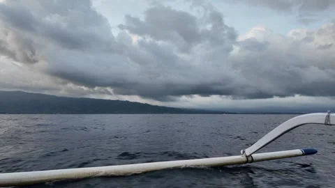 Boat support floats (outriggers) while the boat speeds across the sea 動画素材 346836975