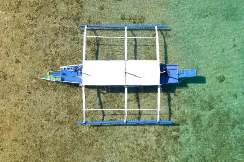 Boat on the surface of the turquoise water Stock Photos