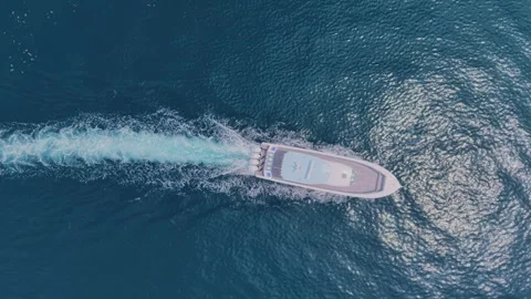 Boat surfing drone shot Stock Footage 318934733