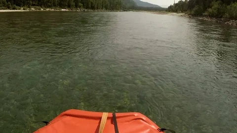 The boat sweeps over the water in the middle of the mountain river  Video stock 84887621