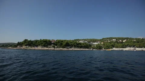 Boat swims to shore Stock Footage 44873985