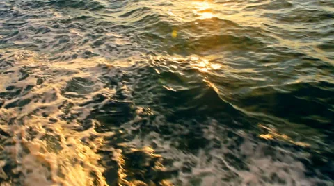 Boat through the waves during sunset Stock Footage 35755148