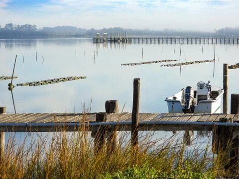 Boat tied up at dock Stock Photos