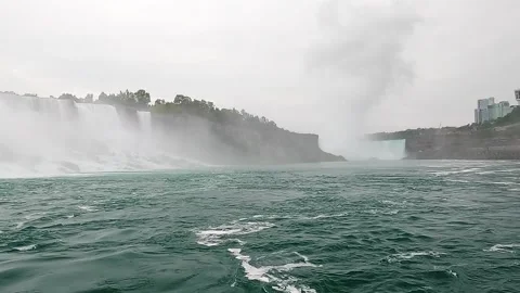 Boat Tour Approaching Niagara Falls Through Powerful Misty Waters Stock Footage 346500515
