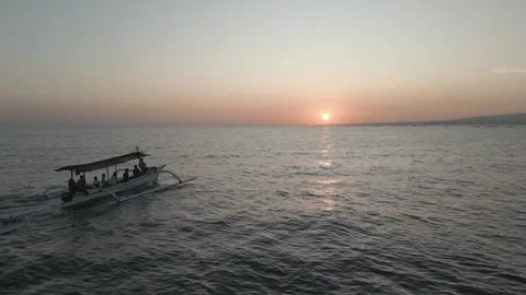 Boat with tourists at sunset in Bali Stock Footage 268892012