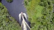 Boat Travelling Down Creek- Aerial Shot. Stock Footage