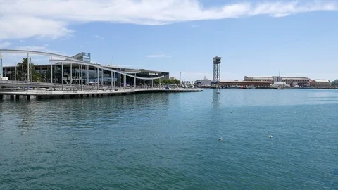 Boat trip along Rambla del Mar boardwalk at Barcelona Port Vell Stock Footage 102607401