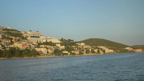 Boat trip in the bay of Neum on the Adriatic Sea with houses, in Bosnia Stock Footage 241701414
