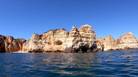 Boat trip on the beautiful rocky cliffs, Algarve, Portugal Stock Footage 106577860