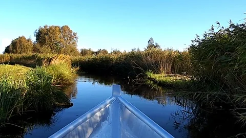 Boat trip through narrow river Stock Footage 124809645