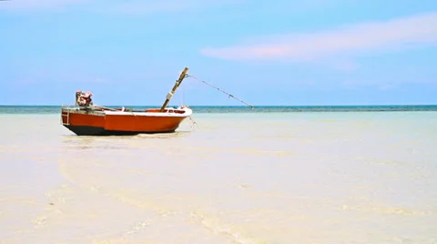 Boat on a tropical beach Stock Footage 37965500