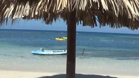 Boat on a tropical beach Stock Footage 138643680