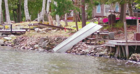 Boat Turned Over on Shore Stock Footage