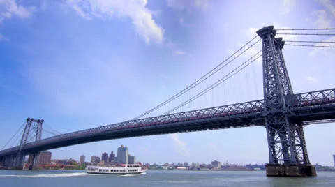 Boat under epic bridge with blue sky Stock Footage 24634408