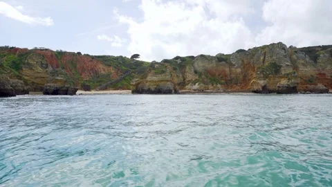 Boat view on cliffs and rocks with secret beaches in Algarve Portugal Stock Footage 273285834