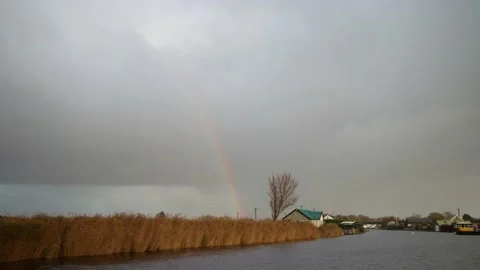Boat View of Norfolk Broads Cloudy Wet Rain Rainbow 4k Stock Footage 222015917