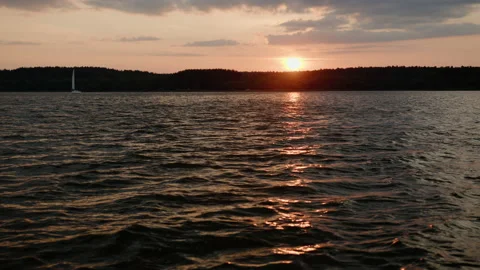 Boat view of the waves on the lake during sunset Stock Footage 235997868