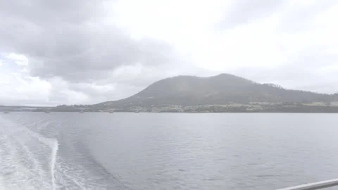 Boat Wake on Derwent River with Mount Wellington and Tasman Bridge Stock Footage 328189188