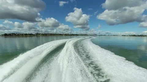 Boat wake in flat water Stock Footage 220642884